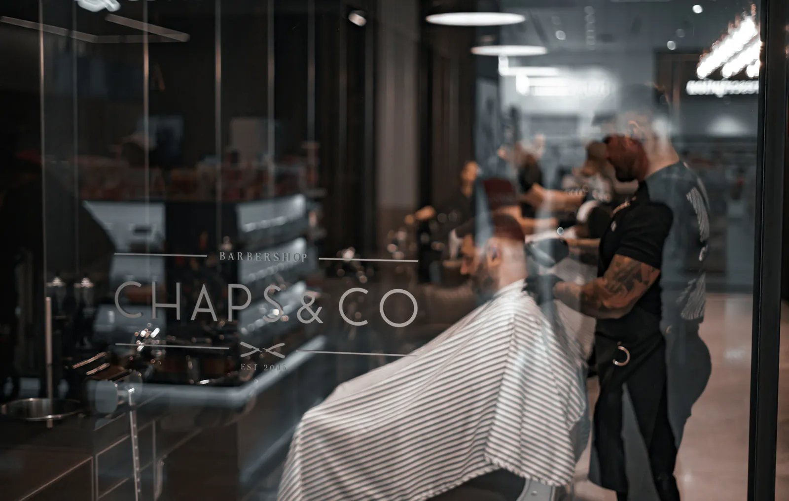 A local barber serving a customer