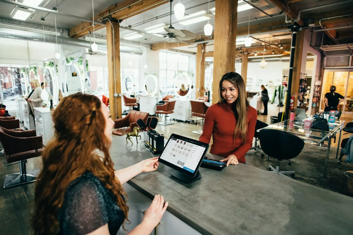 Local business owners reviewing their work together